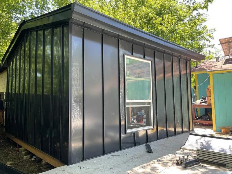 Black standing seam metal wall panels for Roof Inspection in Colchester